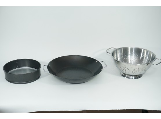 A Group Of Kitchen Accessories Including Wok