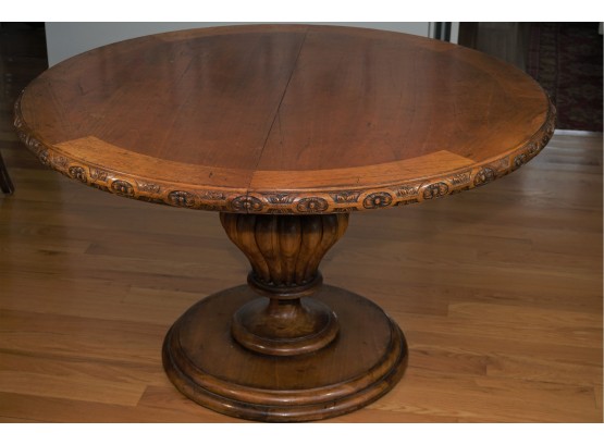 A Ornate Hand-carved Floral Rimmed Extendable Round Dining Table With Leaf