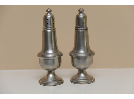 A Pair Of Pewter Salt And Pepper Shakers