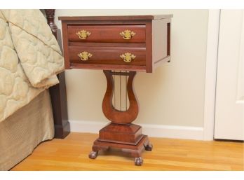 A Harp Base Mahogany Side Table With Ball And Claw Feet