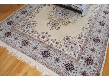 A Cream Center Medallion Rug With Hints Of Blue And Red