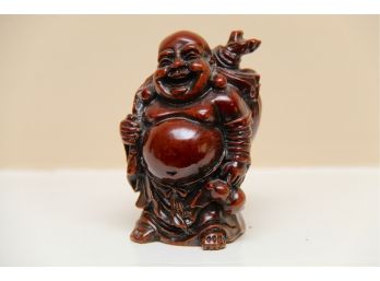 An Asian Carved Buddha Figurine