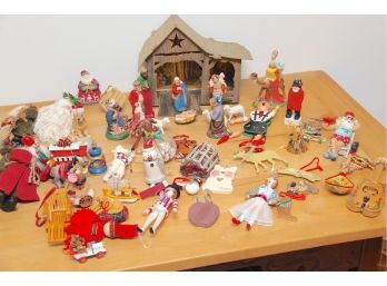 A Collection Of Vintage Christmas Ornaments And Manger