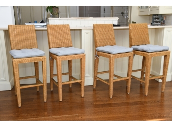 Four Donghia Rattan Stools With Brass Foot Rests