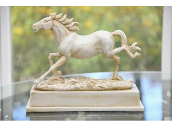 A Molded Resin Horse Sculpture