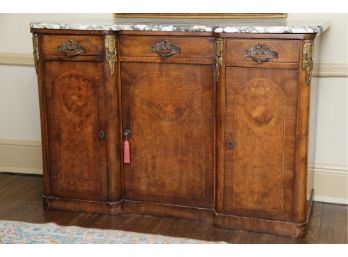 A Burled Mahogany Sideboard With Marble Top