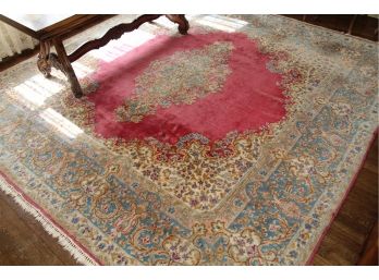 A Hand Knotted Oriental Rug With Wine Colored Center, Medallion & Tasseled Edges