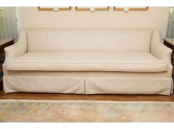 A Cream Colored Fabric Sofa