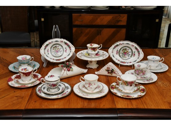 An Eclectic Collection Of Porcelain Tea Cups And More