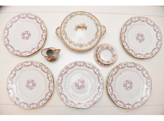 An Assortment Of Limoges Dishes And Serving Bowl