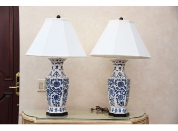 A Matching Pair Of Blue And White Porcelain Table Lamps With White Shades