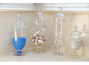 A Collection Of 4 Decorative Covered Jars Filled With Goodies