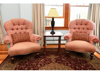 A Pair Of Scarlet Upholstered Arm Chairs With Coordinating Lumbar Pillows