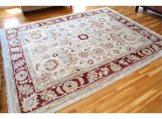 A Hand Woven Wool Pile Rug Made In Pakistan With Hints Of Burgundy And Turquoise