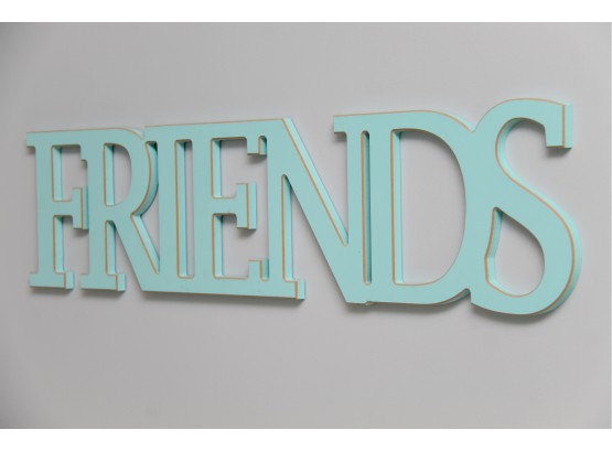 A Turquoise 'Friends' Wall Sign