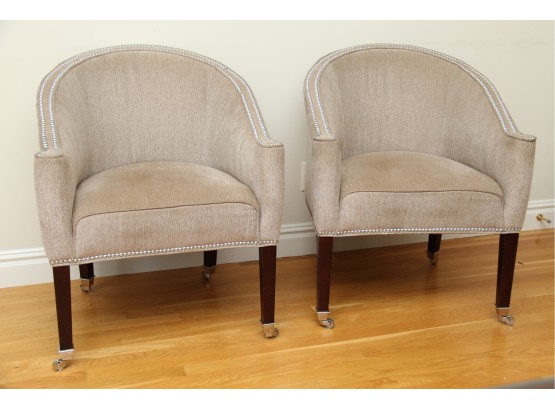 A Pair Of Upholstered Nail Head Trim Chairs On Wheels By Design Masters Furniture Inc.