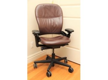 A Leather Adjustable Office Chair In Brown
