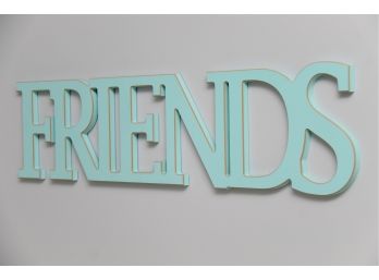 A Turquoise 'Friends' Wall Sign