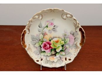 A Hand Painted Porcelain Dual Handle Plate With Crossing Arrows Makers Mark