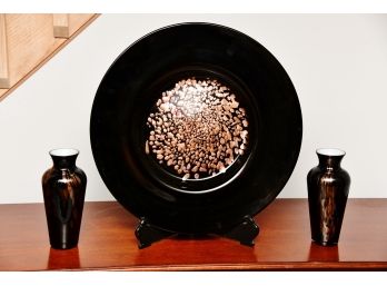 A Decorative Plate With Coordinating Matching Vases