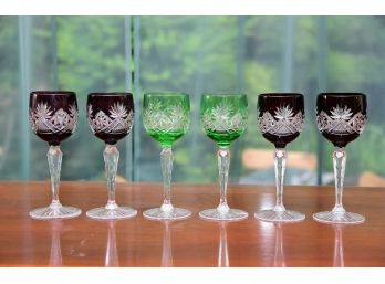 A Collection Of Colored Cut To Clear Wine Glasses