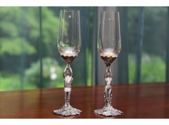 A Pair Of Pewter Stem Champagne Glasses