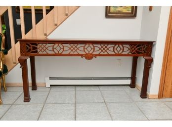 A Mahogany Console Table With Detailed Front Panel