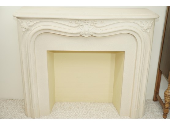 A Decorative Faux Stone Fireplace And Mantel