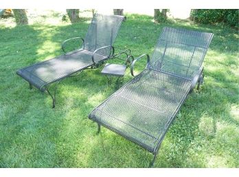 Pair Of Wrought Iron Lounge Chairs With Purple Cushions And Small Side Table