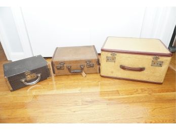 A Trio Of Antique Leather Bound Suitcases