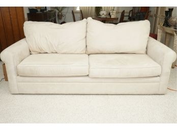 A Paladin Industries Cream Pullout Bed Couch