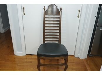 A Drexel Enterprises Wooden Black Cushioned Chair