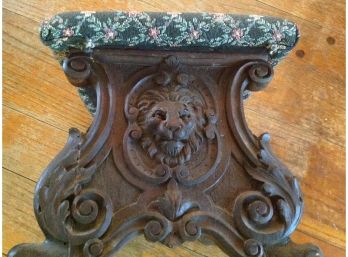 A Carved Mahogany Lion Head Tapestry Footstool