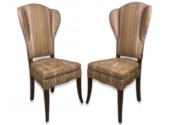 A Matching Pair Of Tufted Wingback Chairs