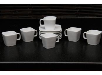 A Set Of Crate And Barrel Demitasse Cups And Saucers