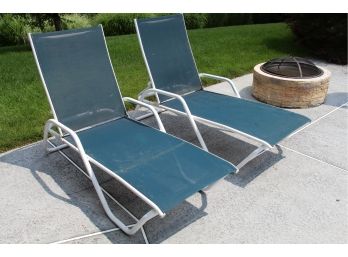 A Matching Pair Of Blue And White Chaise Lounges