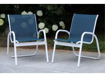 A Matching Pair Of Blue And White Outdoor Chairs