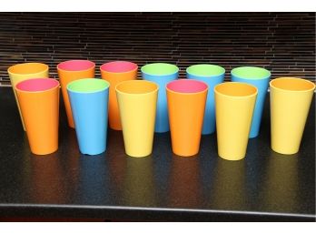 A Set Of 12 Colorful Dennis East Drinking Cups