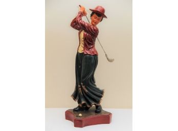 A Large Golf Statue Of A Woman