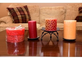 A Group Of Candles Including 2 Wooden Plates And A Metal Stand