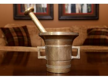 A Solid Brass Mortar And Pestle