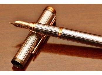 A Silver And Gold Waterman Fountain Pen With 18k Gold Tip