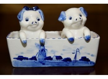 A Delfts Blue Hand Painted Salt And Pepper Shakers