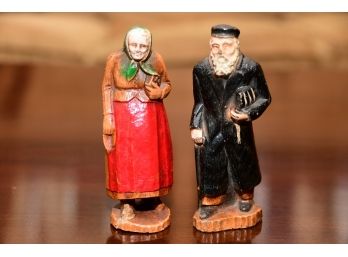 A Pair Of Painted Wooden Old Jewish Couple Figures