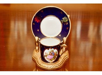 A Limoges Gold Rimmed Porcelain Plate And Cup On Bronze Stand