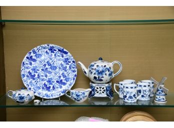 A Blue And White Tea Set With Serving Dish