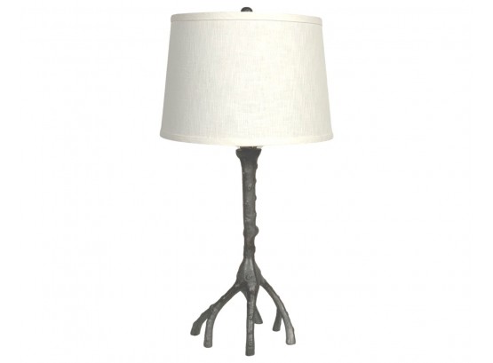 A Metallic Tree Branch Table Lamp With Linen Shade
