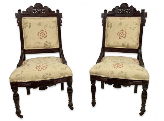 Pair Of Upholstered Side Chairs On Wheels With Floral Cushion