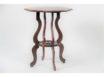 A Mahogany Pie Crust Side Table With Lower Shelf