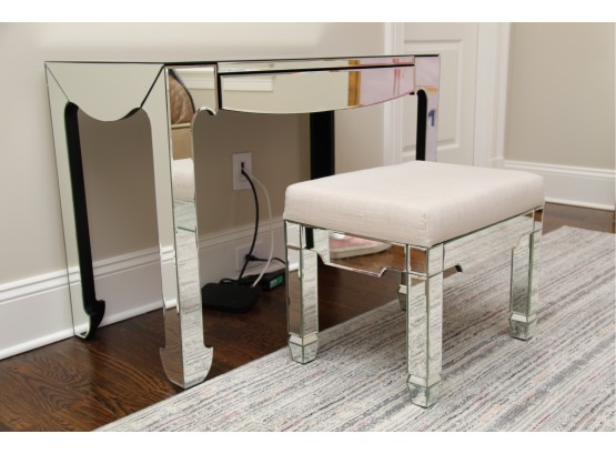 A Mirrored Vanity Table With Coordinating Linen Covered Vanity Bench